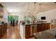Open-concept kitchen features granite countertops and stainless steel appliances at 1434 Chanson Ct., Little River, SC 29566