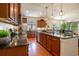 Open kitchen with granite countertops, stainless steel appliances, and ample cabinet space at 1434 Chanson Ct., Little River, SC 29566