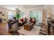 Bright living room features hardwood floors, neutral walls, and plenty of seating at 1434 Chanson Ct., Little River, SC 29566