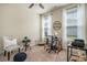 Bright office space featuring two windows and neutral decor, perfect for a home office at 1434 Chanson Ct., Little River, SC 29566
