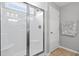 Bright bathroom showcasing a glass-enclosed shower and neutral tile flooring at 1536 Abberbury Dr., Conway, SC 29527
