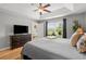 Primary bedroom with tray ceiling and a large window overlooking the backyard at 1536 Abberbury Dr., Conway, SC 29527