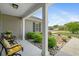 Charming covered front porch with elegant seating area and decorative rock garden at 1536 Abberbury Dr., Conway, SC 29527