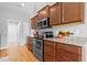 Kitchen features stainless steel appliances, granite countertops, and wooden cabinetry at 1536 Abberbury Dr., Conway, SC 29527