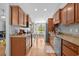 Open kitchen with stainless steel appliances, wood cabinets and granite countertops overlooking a breakfast nook at 1536 Abberbury Dr., Conway, SC 29527