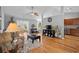 Bright living room boasts hardwood floors, neutral paint, and modern furnishings with a cozy and inviting atmosphere at 1536 Abberbury Dr., Conway, SC 29527