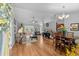 Open-concept living room featuring hardwood floors, neutral colors, and seamlessly connected dining area at 1536 Abberbury Dr., Conway, SC 29527