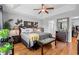 Spacious main bedroom with tray ceiling, hardwood floors, and plenty of natural light at 1536 Abberbury Dr., Conway, SC 29527
