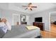 Comfortable main bedroom featuring hardwood floors, tray ceilings, and a large dresser at 1536 Abberbury Dr., Conway, SC 29527
