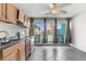 Kitchen and dining area with beach views visible from the open balcony doors at 1600 S Ocean Blvd. # 254, Myrtle Beach, SC 29577