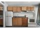Functional kitchen featuring light wood cabinets, a white refrigerator, and standard appliances at 1600 S Ocean Blvd. # 254, Myrtle Beach, SC 29577