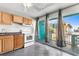 A cozy kitchen with an open door leading to a patio with ocean views at 1600 S Ocean Blvd. # 254, Myrtle Beach, SC 29577
