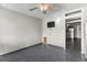 Living area with tile flooring, access to kitchen and bathroom, and a television at 1600 S Ocean Blvd. # 254, Myrtle Beach, SC 29577