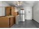 Utility room with tile flooring, drop ceiling, with a stainless refrigerator at 1600 S Ocean Blvd. # 254, Myrtle Beach, SC 29577