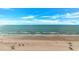 Gorgeous aerial shot of a pristine beach, calm ocean, and clear blue skies, offering a serene coastal view at 1625 S Ocean Blvd. # 1210, North Myrtle Beach, SC 29582