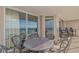 Relax and unwind on this serene balcony with outdoor dining set, showcasing breathtaking ocean views at 1625 S Ocean Blvd. # 1210, North Myrtle Beach, SC 29582