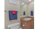Cozy bathroom features a toilet, single vanity, and a framed wall mirror at 1625 S Ocean Blvd. # 1210, North Myrtle Beach, SC 29582