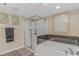 Beautiful bathroom with glass-enclosed shower, garden tub, and elegant wall art at 1625 S Ocean Blvd. # 1210, North Myrtle Beach, SC 29582