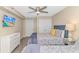 Cozy bedroom featuring two beds, closet storage, and a flatscreen TV for entertainment at 1625 S Ocean Blvd. # 1210, North Myrtle Beach, SC 29582