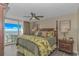 Comfortable main bedroom has a ceiling fan and balcony access with an ocean view at 1625 S Ocean Blvd. # 1210, North Myrtle Beach, SC 29582