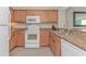 Well-equipped kitchen featuring granite countertops, white appliances, and ample cabinet space for storage at 1625 S Ocean Blvd. # 1210, North Myrtle Beach, SC 29582