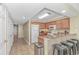 Functional kitchen with breakfast bar, wood cabinets, and essential appliances for easy meal preparation at 1625 S Ocean Blvd. # 1210, North Myrtle Beach, SC 29582