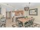 Eat-in kitchen with breakfast bar flows into dining area, perfect for casual meals and entertaining guests at 1625 S Ocean Blvd. # 1210, North Myrtle Beach, SC 29582