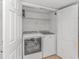 Convenient laundry room featuring a side-by-side washer and dryer, and shelving for storage at 1625 S Ocean Blvd. # 1210, North Myrtle Beach, SC 29582