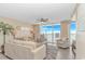 Inviting living room with comfortable furnishings, a ceiling fan, and stunning ocean views from the balcony at 1625 S Ocean Blvd. # 1210, North Myrtle Beach, SC 29582