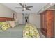 Relaxing main bedroom with closet, decorative lamp, and muted green bedding at 1625 S Ocean Blvd. # 1210, North Myrtle Beach, SC 29582