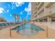 Inviting outdoor pool area with lounge chairs and well-manicured landscaping overlooking the beautiful ocean at 1625 S Ocean Blvd. # 1210, North Myrtle Beach, SC 29582