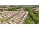 Aerial view of a neighborhood featuring lush landscaping and a community pond in the distance at 1681 Suncrest Dr., Myrtle Beach, SC 29577