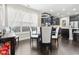 Open dining area featuring modern lighting, a glass table, and views into the kitchen at 1681 Suncrest Dr., Myrtle Beach, SC 29577