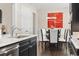 Elegant dining area with stylish lighting adjacent to the kitchen, perfect for entertaining at 1681 Suncrest Dr., Myrtle Beach, SC 29577