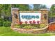 A stone-lined entrance to the Cresswind community featuring beautiful landscaping and clear signage at 1681 Suncrest Dr., Myrtle Beach, SC 29577