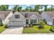 Charming home with a well-manicured lawn, attached garage, and beautiful landscaping at 1681 Suncrest Dr., Myrtle Beach, SC 29577