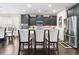 Spacious kitchen with dark cabinets, a stainless steel fridge, and a breakfast bar area at 1681 Suncrest Dr., Myrtle Beach, SC 29577