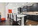 Open kitchen and dining area featuring dark cabinets, granite counters, and stainless appliances at 1681 Suncrest Dr., Myrtle Beach, SC 29577