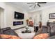 Spacious living room featuring a modern fireplace, ceiling fan, and comfortable seating arrangements at 1681 Suncrest Dr., Myrtle Beach, SC 29577