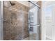 Modern shower with decorative tile surround, glass door, and chrome shower head at 1681 Suncrest Dr., Myrtle Beach, SC 29577