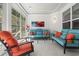 Cozy sunroom with ample seating, large windows, and a view of the outdoors at 1681 Suncrest Dr., Myrtle Beach, SC 29577