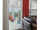 View from living room of a sunroom with comfortable seating and a view of the outdoors at 1681 Suncrest Dr., Myrtle Beach, SC 29577