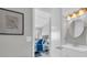 Bright bathroom with a decorative mirror and a glimpse into the bedroom at 1709 S Ocean Blvd. # 403, North Myrtle Beach, SC 29582