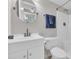 Clean, well-lit bathroom with a white vanity, toilet, and shower at 1709 S Ocean Blvd. # 403, North Myrtle Beach, SC 29582