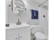 Bathroom with modern vanity, toilet, and shower with blue towels at 1709 S Ocean Blvd. # 403, North Myrtle Beach, SC 29582