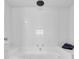 Modern tiled bathroom with a large soaking tub and sleek shower head at 1709 S Ocean Blvd. # 403, North Myrtle Beach, SC 29582