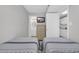 Shared room featuring twin beds with a bathroom and kitchen in the background at 1709 S Ocean Blvd. # 403, North Myrtle Beach, SC 29582
