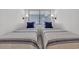 Cozy bedroom featuring two twin beds and two wall lamps at 1709 S Ocean Blvd. # 403, North Myrtle Beach, SC 29582