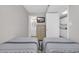 Bedroom with two beds, dresser, TV, and access to a full bathroom and kitchen at 1709 S Ocean Blvd. # 403, North Myrtle Beach, SC 29582