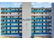 Exterior facade of condo building showcasing many units with exterior balconies and views at 1709 S Ocean Blvd. # 403, North Myrtle Beach, SC 29582